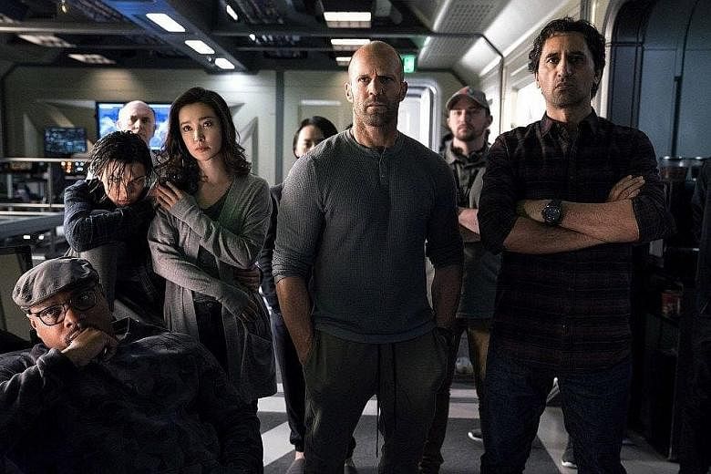 The Meg stars (foreground left) Page Kennedy, (second row, from left) Ruby Rose, Li Bingbing, Jason Statham and Cliff Curtis.