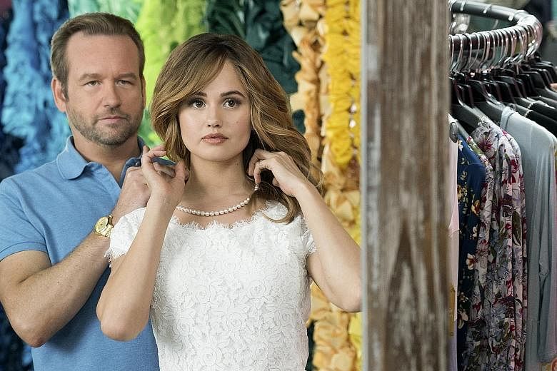 Patty (Debby Ryan) and her pageant coach Bob (Dallas Roberts) in Insatiable.