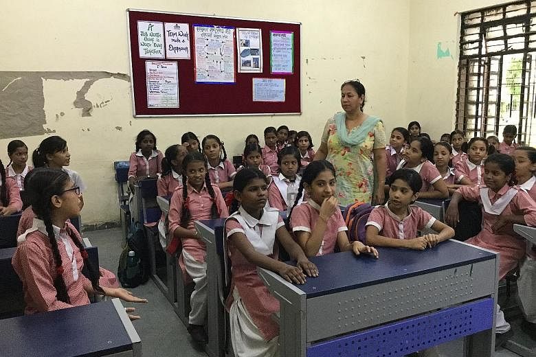 Students attending a "Happiness Curriculum" class in a New Delhi school two weeks ago. The programme was launched in Delhi schools last month to help students cope with stress. Under the programme, students get to put away their books for half an hou