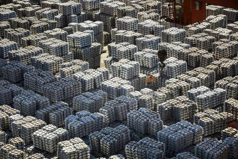 Bundles of aluminium ingots at a Chinese stockyard in Wuxi in the country's southern Jiangsu province. The latest round of tariffs took effect amid two days of trade talks in Washington between mid-level officials from both sides, but US President Do