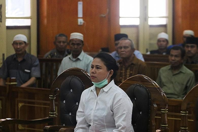 Meliana, a 44-year-old Buddhist, in court in Medan, Sumatra, on Tuesday. The mother of four was found guilty of blasphemy and sentenced to 11/2 years in prison for commenting on the volume of the call to prayer from a mosque speaker.