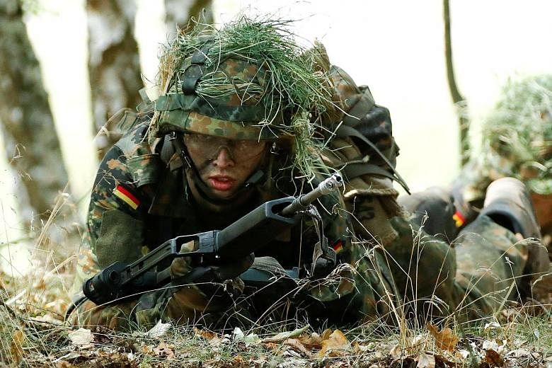 A German army recruit taking position during training in Viereck, Germany. Compulsory military service in Germany ended in 2011 and the military, or Bundeswehr, has stepped up efforts to recruit youngsters. The Bundeswehr is now seen by students as t
