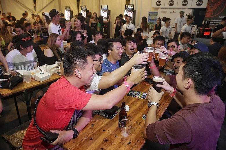 Guests making a toast at Beerfest Asia 2016. This year's festival offers more than 600 local and international beers, plus limited-edition Beerfest Asia Birthday Beers.