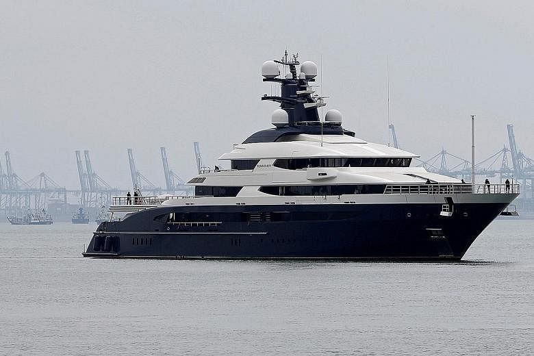 Seized superyacht Equanimity (top) in Port Klang, Malaysia, earlier this month, while a Bombardier Global 5000 without a body number (above) is seen parked at Seletar Airport in February last year.