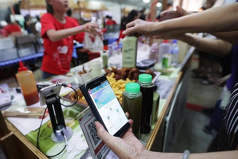 All 10 stalls run by youth entrepreneurs at the Yio Chu Kang carnival offered cashless payments.