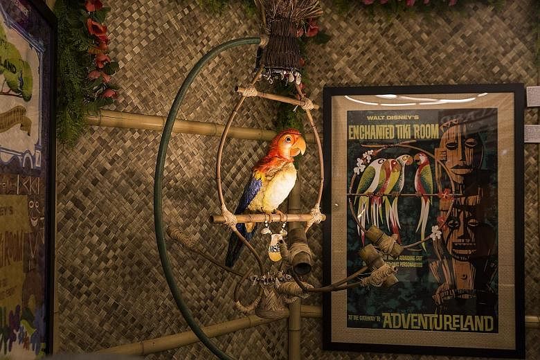 (Left) Jose the macaw from the Enchanted Tiki Room, an attraction in Disneyland. (Left) Mr Kraft put his collectables on the auction block, with a Dumbo the Flying Elephant ride vehicle going for US$150,000 (S$204,700). Mr Richard Kraft, a talent age