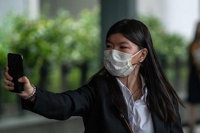 Ms Khaw May Ling, the eldest daughter of Khaw Kim Sun, who is accused of murdering his wife and his younger daughter, leaving the High Court yesterday. She told the court she was aware of her father's affair with her tutor.