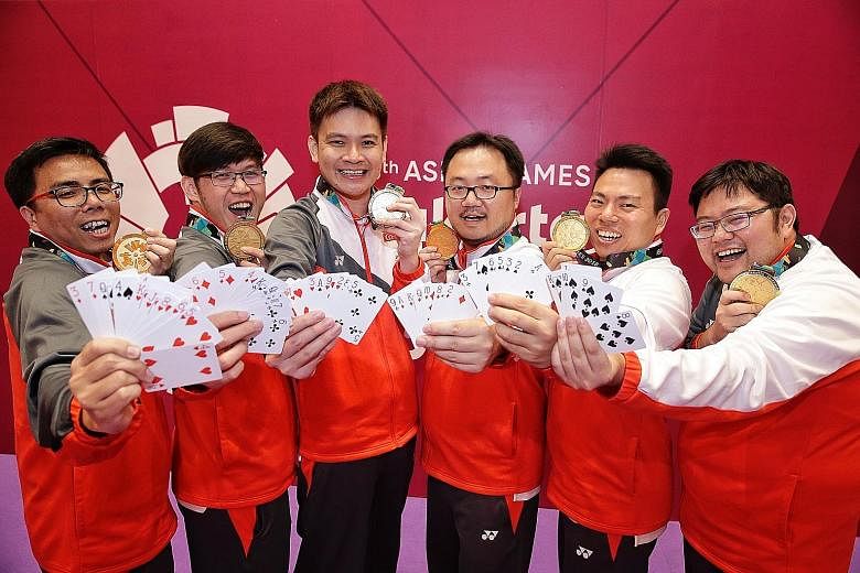 Singapore's contract bridge team at the Asian Games (from left) Fong Kien Hoong, Desmond Oh, Loo Choon Chou, Zhang Yukun, Poon Hua and Kelvin Ong played their cards right to win the gold medal for the Republic.