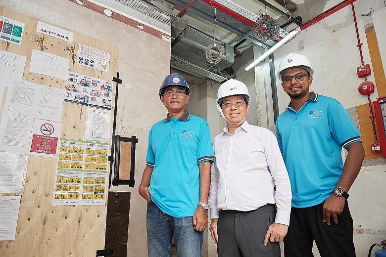 QXY Resources' head of safety Mohd Yazid Mohd Yasin (from far left) with the company's managing director Patrick Koh and management associate Shanthakumar Sinniah.
