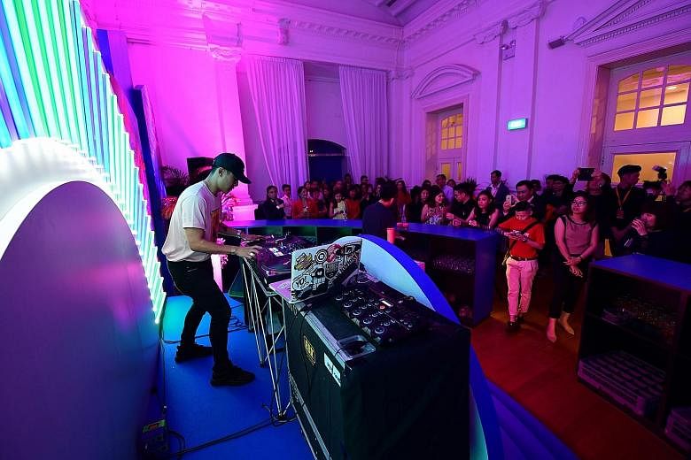 DJ KoFlow, one of the 80 home-grown talents to be featured in the Singapore Tourism Board's new campaign, playing a set at the launch event at the Arts House yesterday. The STB will organise several overseas events under the Passion Made Possible bra