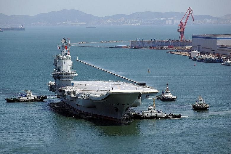 China's first domestically developed aircraft carrier in Dalian port on May 18 after completing its first sea trials.