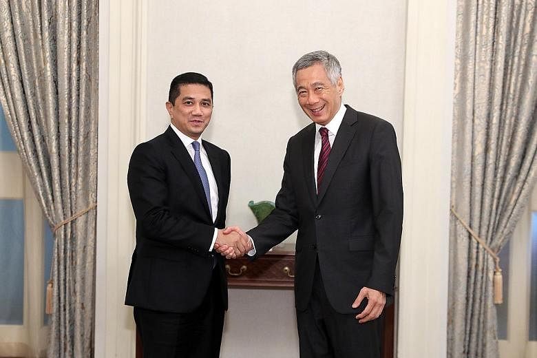 Prime Minister Lee Hsien Loong with Malaysian Economic Affairs Minister Azmin Ali.