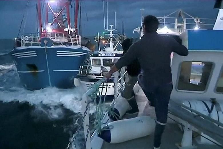 A still image taken from a video shows French and British fishing boats colliding during the scrap in the English Channel on Tuesday over scallop fishing rights.