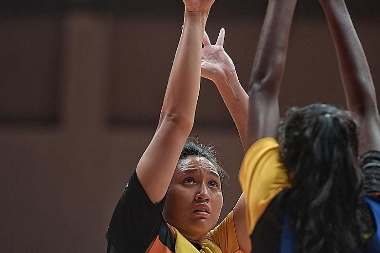 Malaysian player An Najwa Azizan taking a shot during training at the OCBC Arena on Thursday, ahead of the Asian Netball Championship starting today.