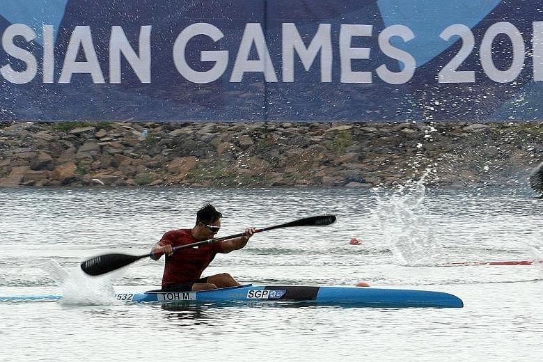Mervyn Toh rowing his way to a historic first canoeing Asian Games medal for Singapore. While he is happy with the feat, he is unsure of his future in the sport as he won't be able to train as much as he would like because of work commitments.