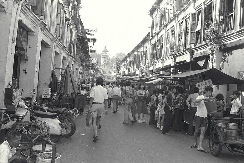 Hawkers in Hock Lam Street in 1975. At that time, hundreds of street hawkers in the city were asked by the Environment Ministery to fill up empty stalls in existing hawker centres. These hawkers, many of whom have been operating for years in side str