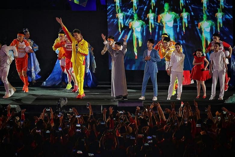 Swimmer Sun Yang (in yellow) making an appearance with Alibaba founder Jack Ma to welcome Asia to the Chinese city of Hangzhou - their birthplace and the host of the 2022 Asian Games.