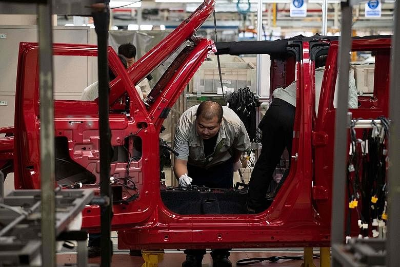 An SUV production line for the Beijing Automotive Group in Beijing. China's export orders shrank for a fifth month in August and manufacturers are cutting more staff.