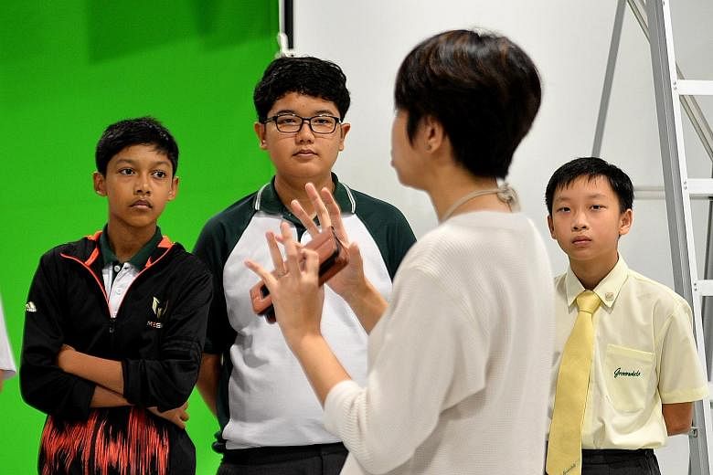 Greendale Secondary School students (from left) Feroz Khan Abdul Rahman, Irfan Yusry Iszreen and Albert Loh, on a tour of Pixel Building in Buona Vista, as part of the annual N.E.mation contest.