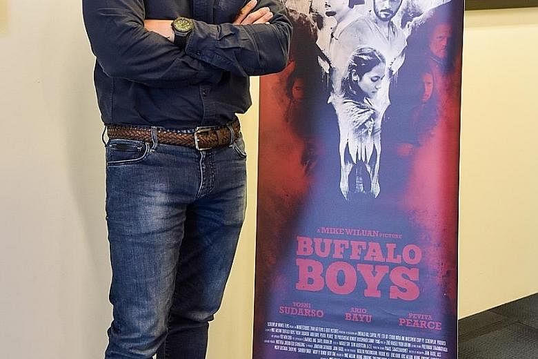 Buffalo Boys, a film set in 19th-century Java about two brothers seeking vengeance for their parents' death, is the directorial debut of Mike Wiluan (left), chief executive of media company Infinite Studios.