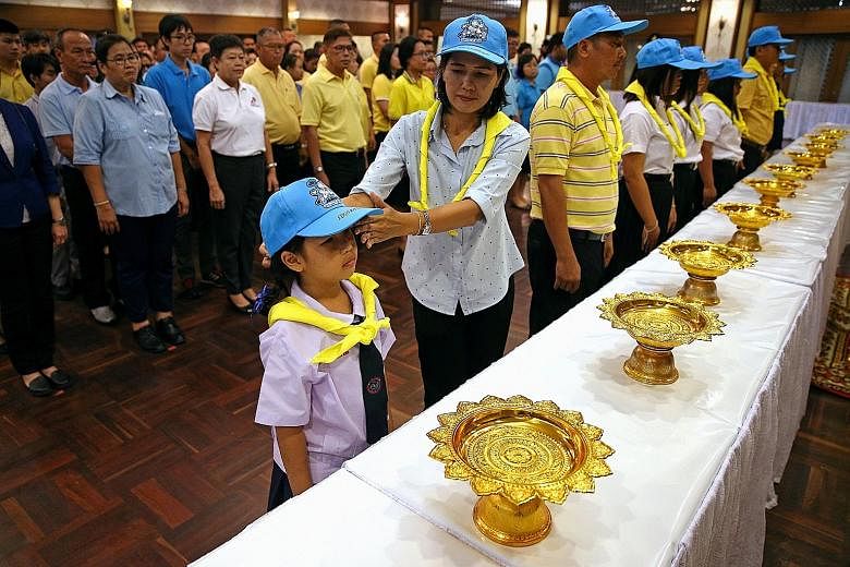 People attending a ceremony to join the Volunteer Spirit scheme in Bangkok last month. Over four million volunteers from all walks of life have joined the programme, said officials.