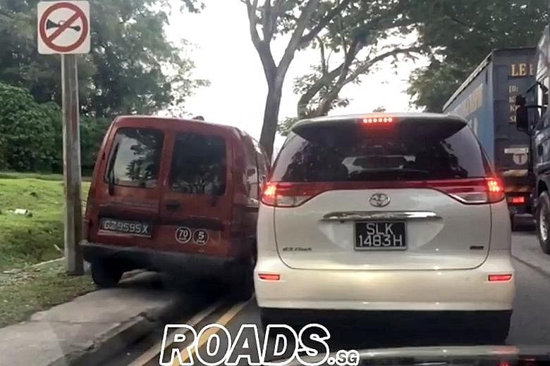 The red van is seen in a video uploaded online moving slowly on the pavement. Driver Jason Zy Cheong said he was in a hurry to pick up his child from the childcare centre and apologised for his behaviour.