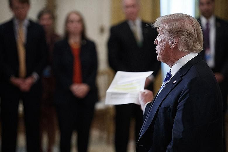 US President Donald Trump responding to a question from the news media after delivering remarks during a meeting with sheriffs from across the country at the White House on Wednesday. The New York Times column drew immediate and extraordinary attenti