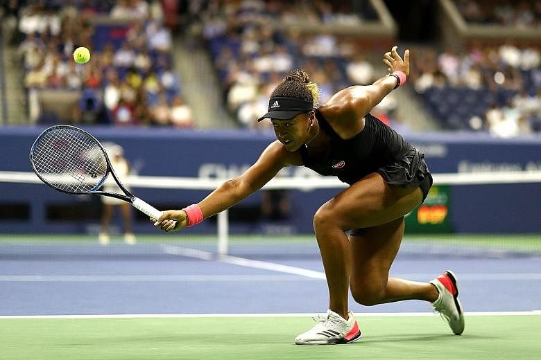 Naomi Osaka stretching for a backhand return to American Madison Keys in the US Open semi-finals on Thursday in New York. The Japanese won 6-2, 6-4 to enter her first Grand Slam final.