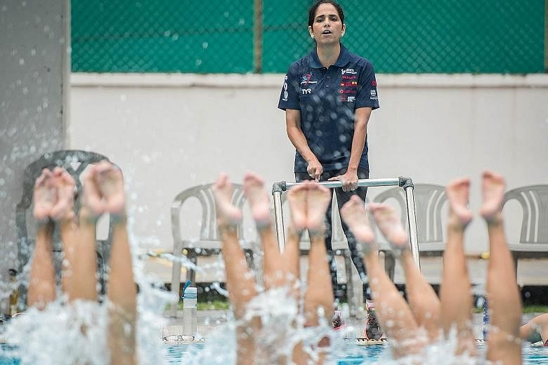Geraldine Narvaez, the new head coach of the Singapore team, observing the artistic swimmers during the clinic at Toa Payoh Swimming Complex yesterday. In particular, she wants to improve their flexibility and acrobacy.