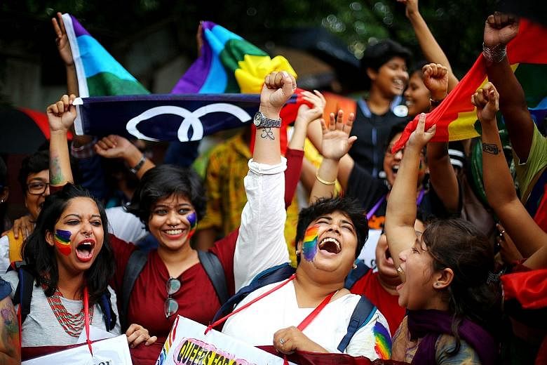 Activists of the Indian lesbian, gay, bisexual, and transgender community celebrating the Indian Supreme Court verdict at a rally in Kolkata, in eastern India, on Thursday.