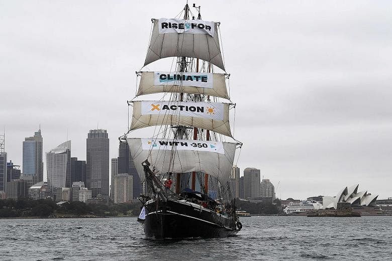 SYDNEY:The banners on the Southern Swan vessel refer to environment advocacy group 350 which spearheaded the global protest.