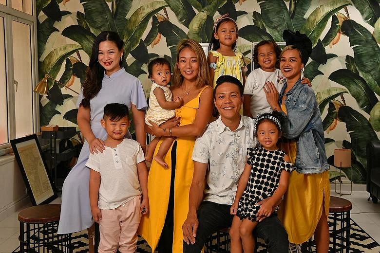 Founders of the Life Beyond Grades movement (from left): Ms Tjin Lee, with her son, Tyler Lim; Ms Charmaine Seah, carrying daughter Dahlia Jaymes Ong; Mr Derek Ong, with daughter Charlie Rose; and Ms Aarika Lee with her children, Ari Jon (in white T-