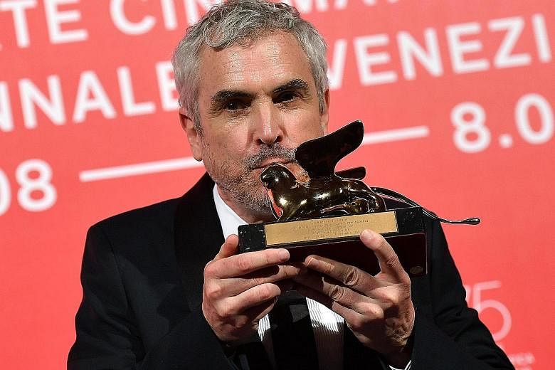 Mexican director Alfonso Cuaron with the Golden Lion award at the Venice film festival.