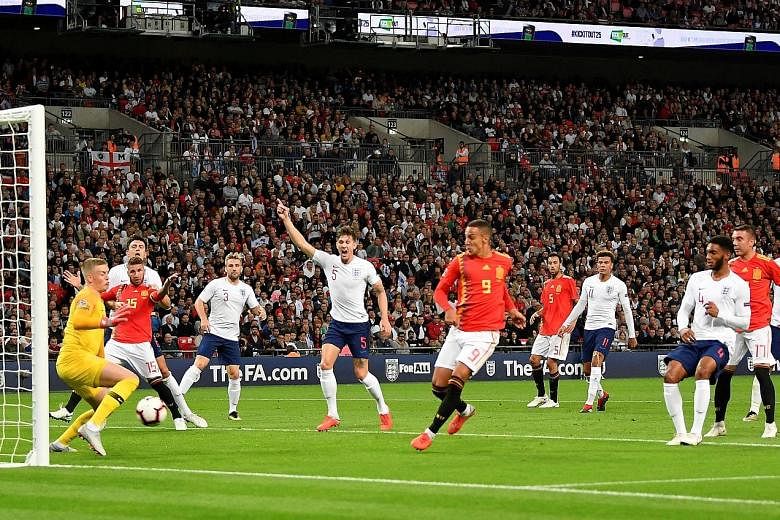 Rodrigo (No. 9) scoring Spain's second goal against England, who had Danny Welbeck's late strike ruled out by referee Danny Makkelie.