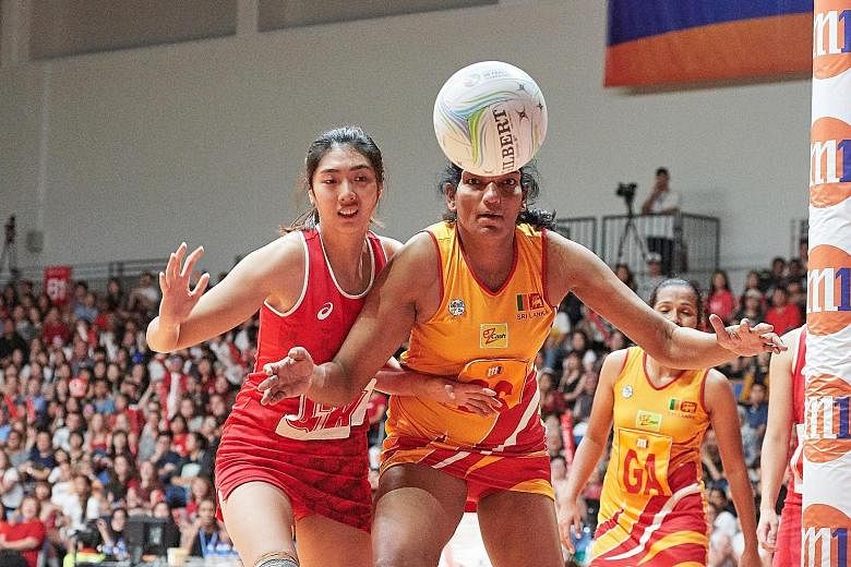 Singapore's goal-keeper Chen Lili and her team-mates had no answer to the 2.08m goal-shooter Tharjini Sivalingam, who scored all but one of Sri Lanka's 69 points against the Republic in yesterday's final.