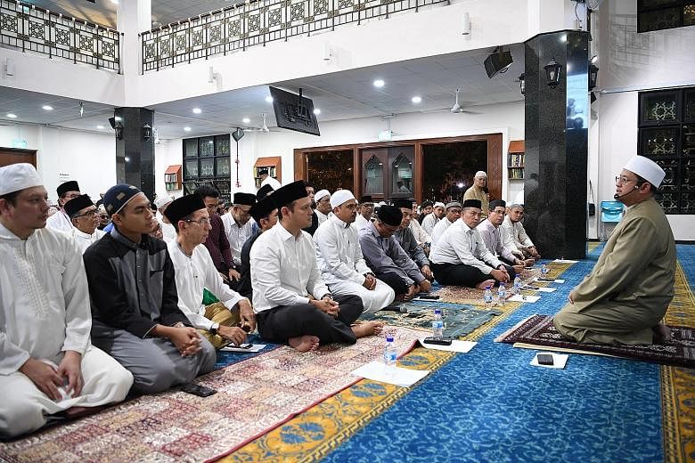 Mufti Fatris Bakaram, Singapore's highest Islamic authority,	giving a short sermon at the commemoration of the Islamic New Year held at Al-Khair Mosque yesterday, in line with the celebration's theme of Striving with Confidence, Serving with Compassi
