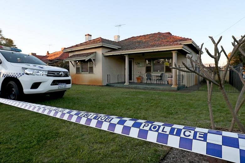 Police outside the family home in Perth on Sunday, where five bodies were found. The accused is said to have killed his wife, three toddlers and his mother-in-law over two days but turned himself in only a week later.