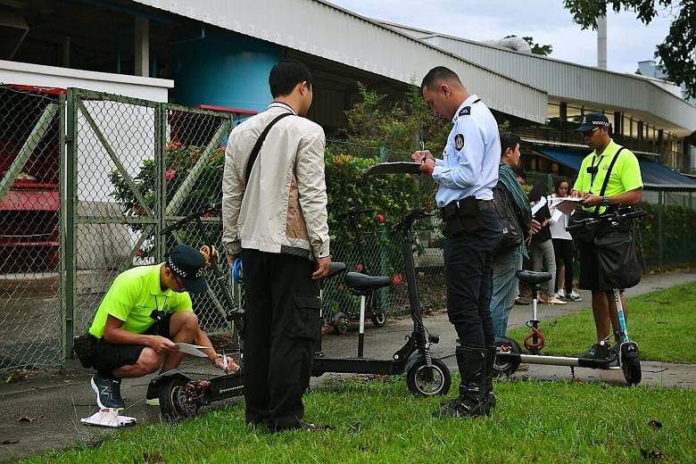 LTA officers conducting an enforcement operation along Loyang Drive earlier this year. Between May 1 and Aug 15, officers recorded 1,300 offences, including reckless riding.