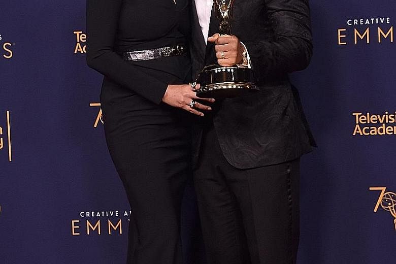 Singer John Legend and his wife, model Chrissy Teigen, at the Creative Arts Emmys ceremony on Sunday.
