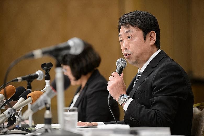 Mr Michio Arikuni, president of Suruga Bank, at a news conference last Friday. Suruga Bank's top executives resigned after an independent panel found that weak governance led to a loan scandal that has rocked the Japanese regional bank.