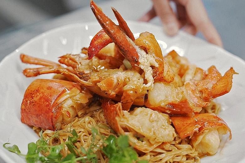 One of the signature dishes of chef Yong Bing Ngen (above) of Majestic Restaurant is lobster noodles (left).
