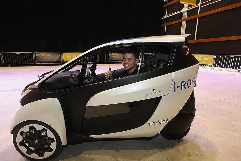 Joseph Schooling test driving the electric-powered Toyota i-Road at the "Start Your Impossible" initiative launch at Infinite Studios yesterday. The zero-emission mobility device is one example of Toyota's solutions at the Tokyo Olympic and Paralympi