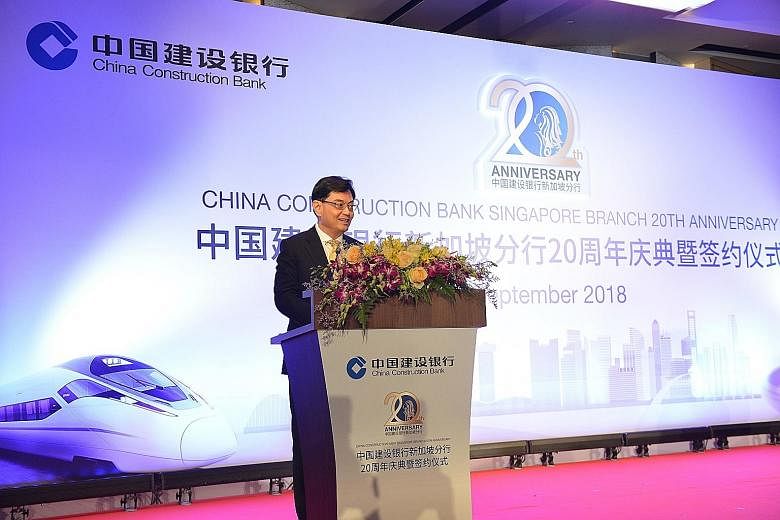 Finance Minister Heng Swee Keat speaking at China Construction Bank Singapore's 20th anniversary event yesterday.