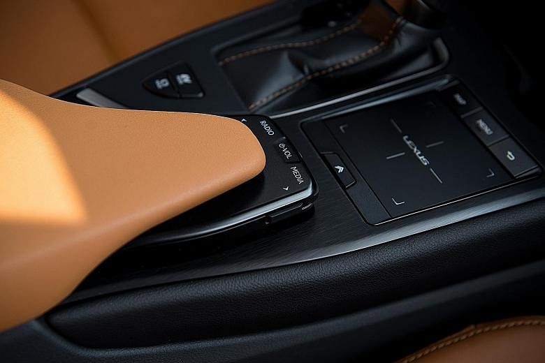 The interior of the Lexus UX200 includes a dash top lined with a surface reminiscent of Japanese washi paper, a large infotainment screen paired with a user-friendly touchpad, and hi-fi controls recessed in the beak of the centre armrest. The Lexus U