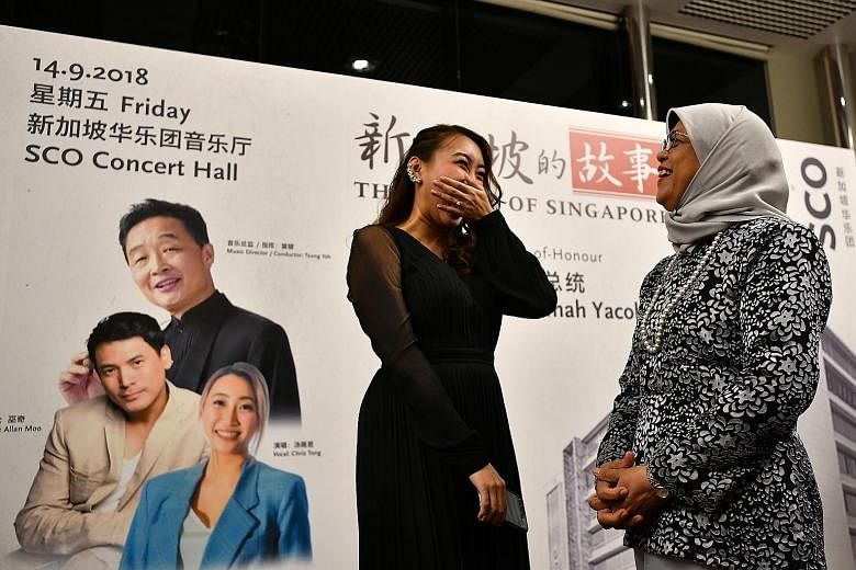 President Halimah Yacob with vocalist Chriz Tong, who sang at Lianhe Zaobao's 95th anniversary concert (left) yesterday. Titled "The Story of Singapore", the two-day concert, which ends today, is a collaboration between Singapore Press Holdings and t