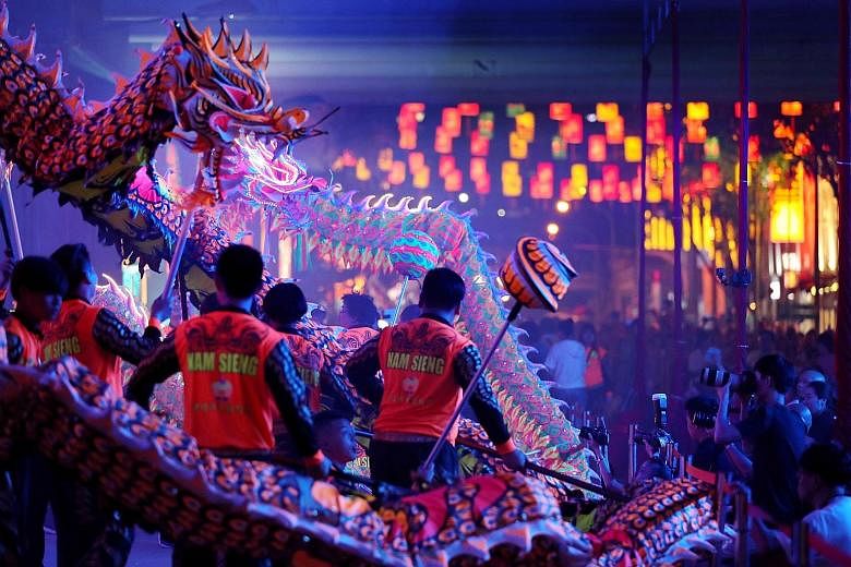 Changi Airport: One of the six displays across its four terminals. Chinatown: A dragon-dance performance by the Nam Sieng Dragon & Lion Dance Activity Centre (above) at the light-up and opening ceremony of this year's Mid-Autumn Festival last Saturda