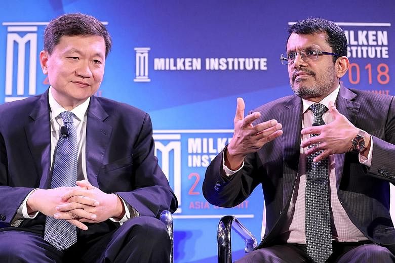 Monetary Authority of Singapore managing director Ravi Menon and CreditEase founder and CEO Tang Ning at the Milken Institute's Asia Summit, which wrapped up yesterday. A two-day Singapore Summit, where Asia's leaders discuss regional and global chal