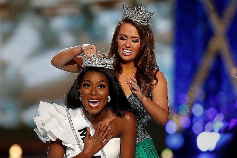 Miss New York Nia Imani Franklin being crowned Miss America by the outgoing title holder Cara Mund last Sunday. The 98th Miss America competition in Atlantic City, New Jersey, this year has been rebranded the socially aware Miss America - or "Miss Am