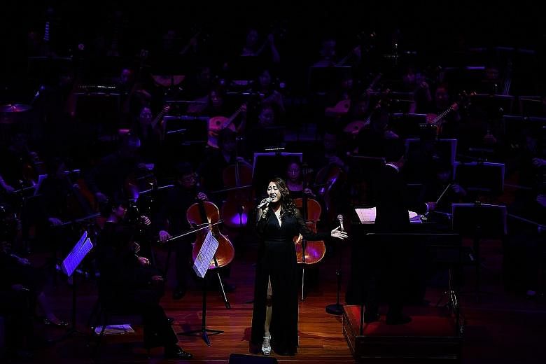 Vocalist Chriz Tong singing at The Story Of Singapore concert commemorating the 95th anniversary of Chinese newspapers in Singapore.