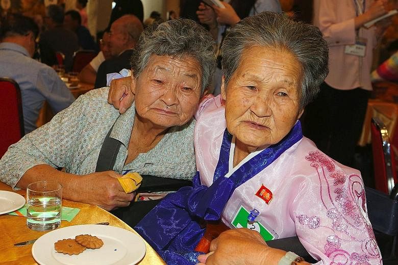 North Korean Kang Ho Rye (right), 89, hugging her South Korean sister Kang Du-ri, 87, as they bid farewell at the last meeting of a three-day family reunion event at North Korea's Mount Kumgang resort on Aug 26. Millions of Koreans were separated fro
